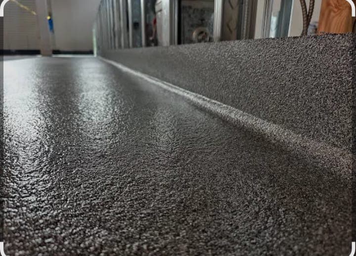 Close-up of a professionally finished quartz epoxy floor surface